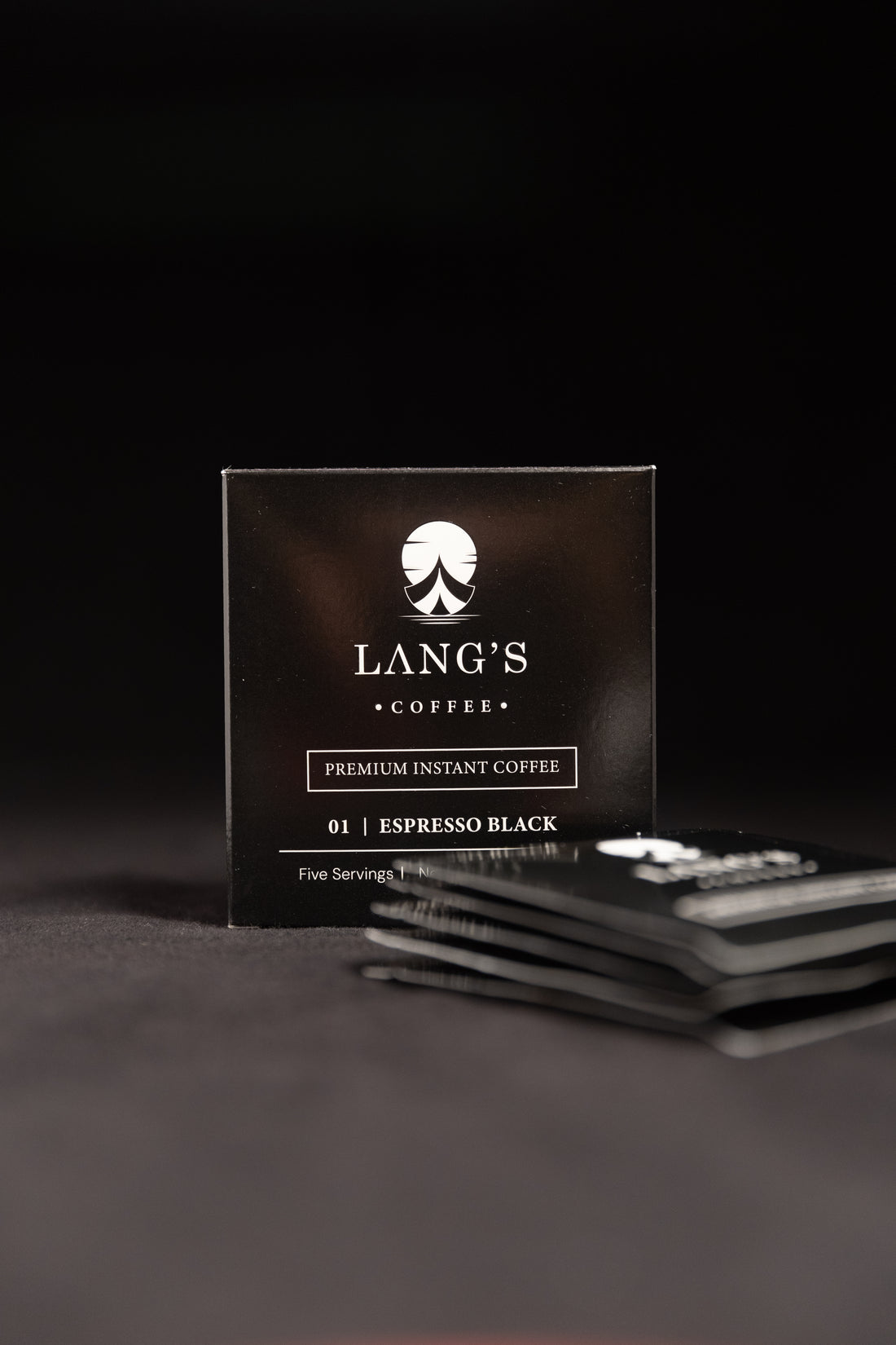 Box of Lang's Coffee Espresso Black on a dark background